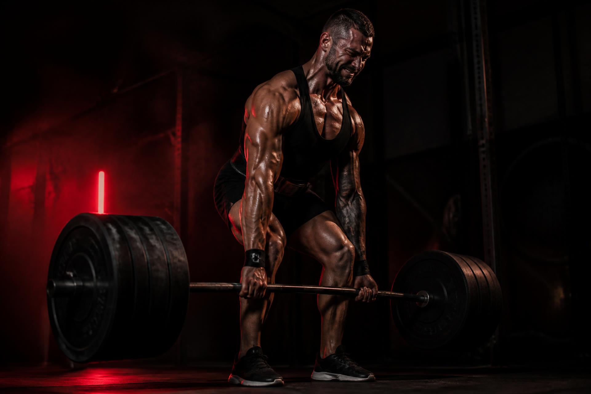 Athlete performing a heavy barbell deadlift at Pro Athletic